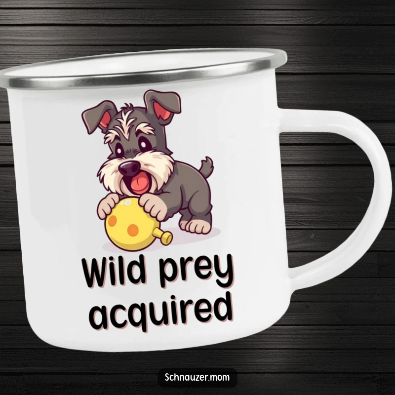 Funny Schnauzer lady camping mug showing a dog playfully pouncing on a squeaky toy, ready for outdoor fun and humorous moments.