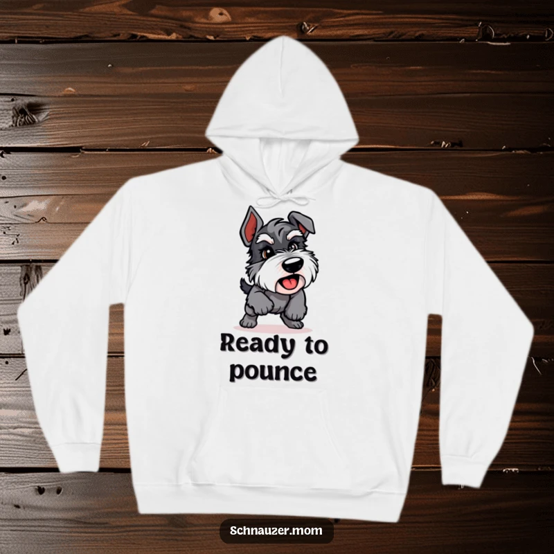 Funny Schnauzer hoodie showing an energetic dog in a playful pounce, offering warmth and a dynamic design.