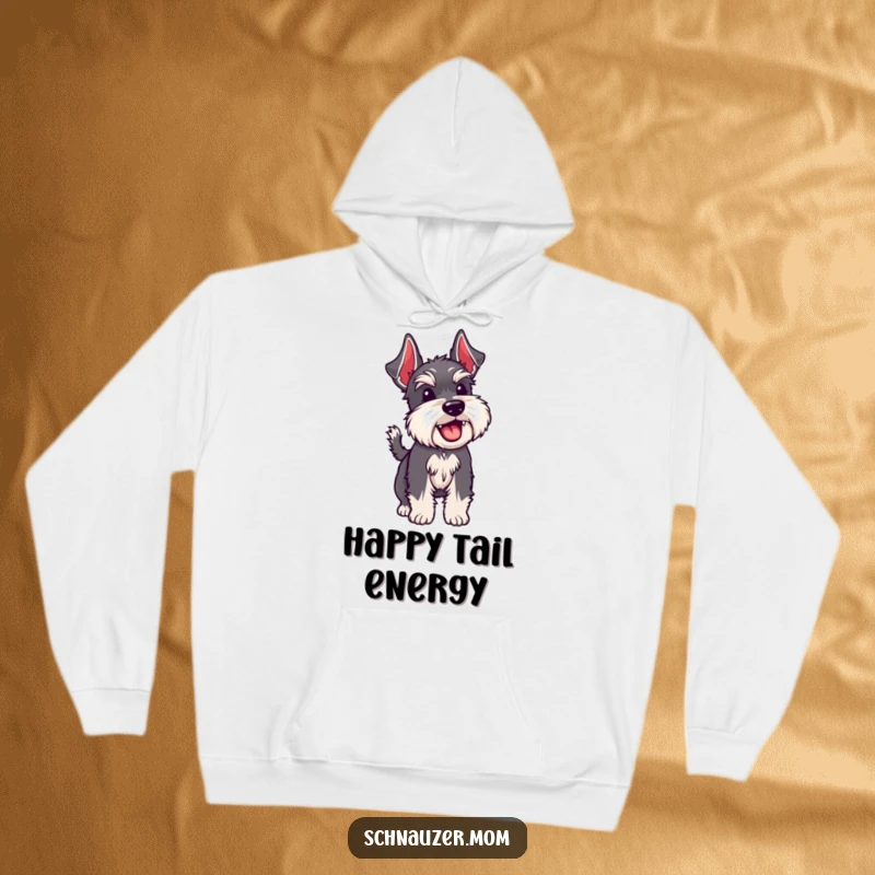 Funny Schnauzer dog wagging its bristly tail, creating a cozy and happy feeling in a hooded sweatshirt.