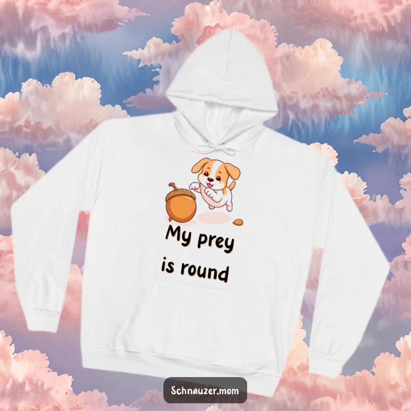 Funny hoodie depicting an agile dog pouncing on an acorn, embodying playfulness and quick movement, a great gift.