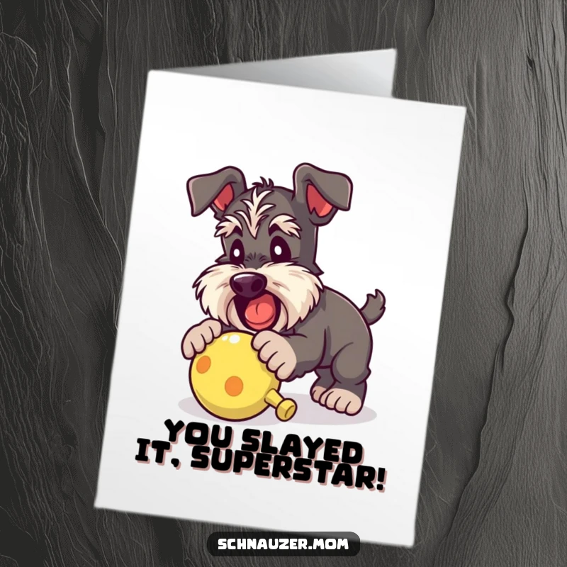 Funny Free Printable Schnauzer Congratulations Card capturing a dog excitedly pouncing towards a squeaky toy for a win.