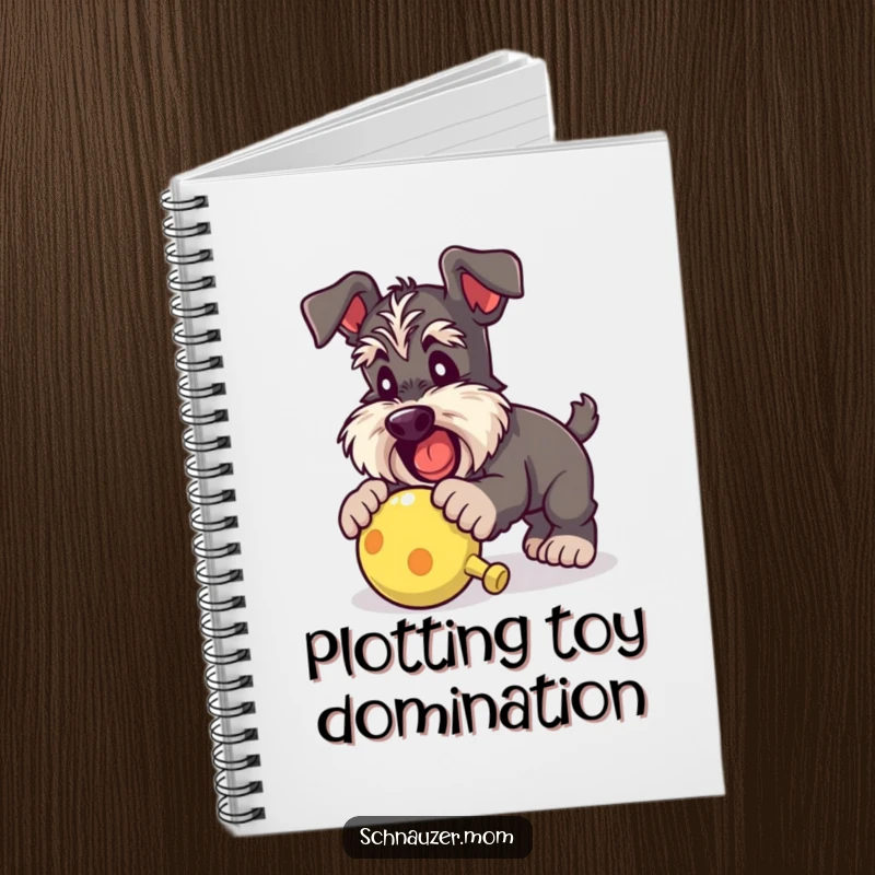 Funny Schnauzer lady notebook featuring a dog enthusiastically pouncing on a squeaky toy, ideal for capturing notes with playful energy.