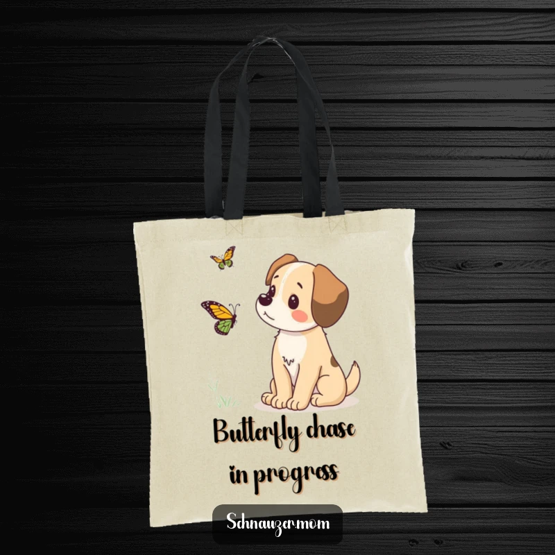 Funny tote bag featuring a dog's concentrated gaze upon a fluttering butterfly, a humorous and practical accessory for any pet lover.